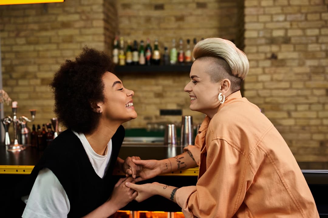Two,Women,Standing,Outside,A,Vibrant,Bar.