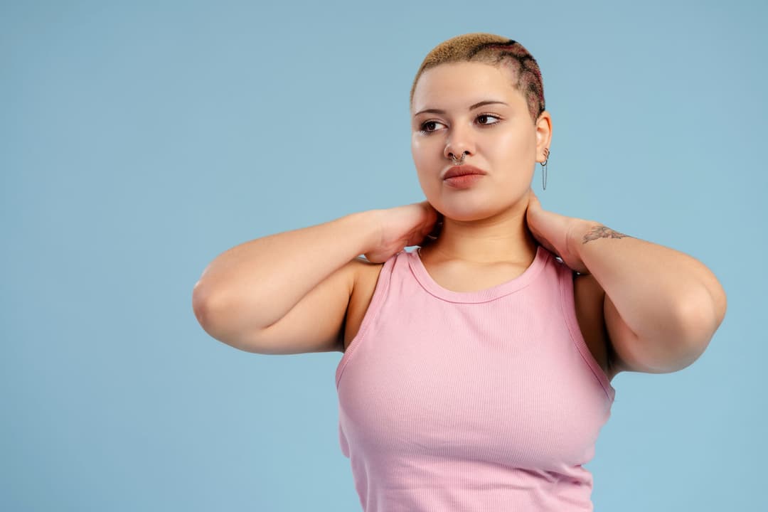 Studio,Shot,Of,A,Young,Queer,Person,With,Shaved,Hair
